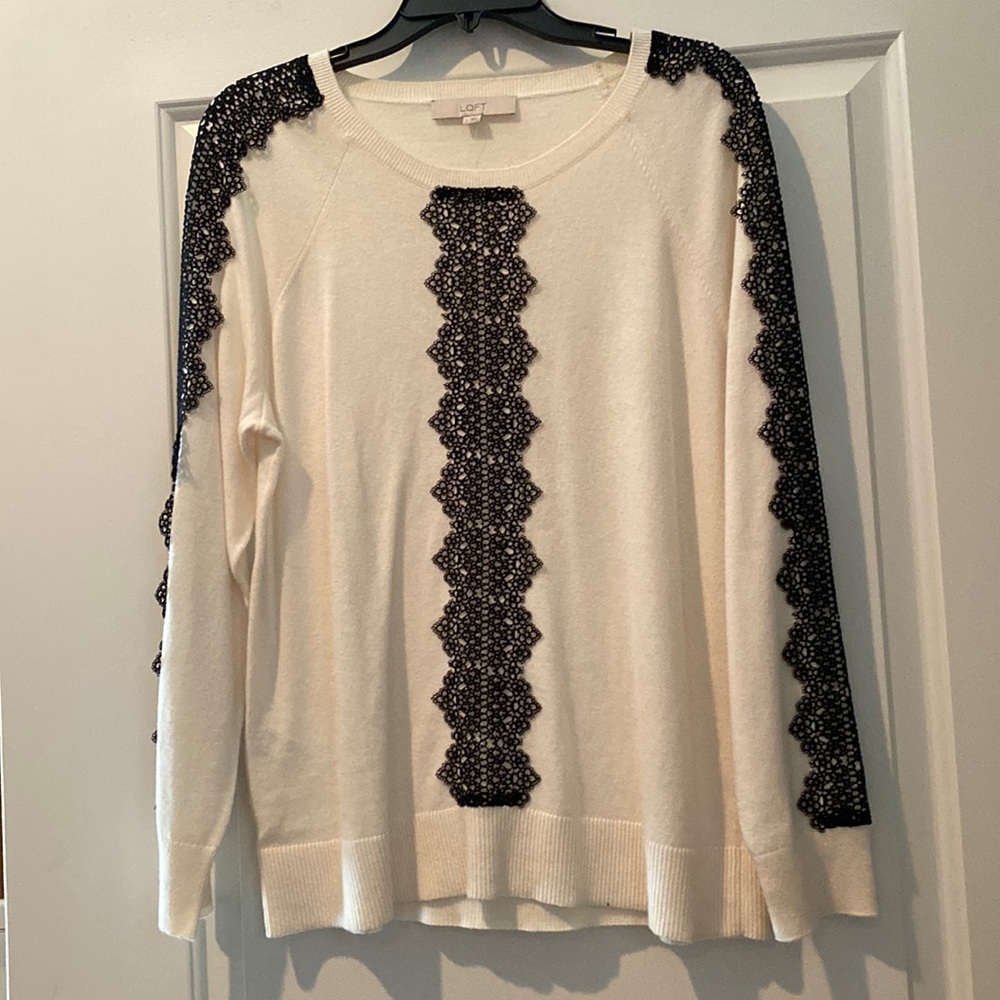Loft long sleeved ivory sweater with black lace trim. NWT